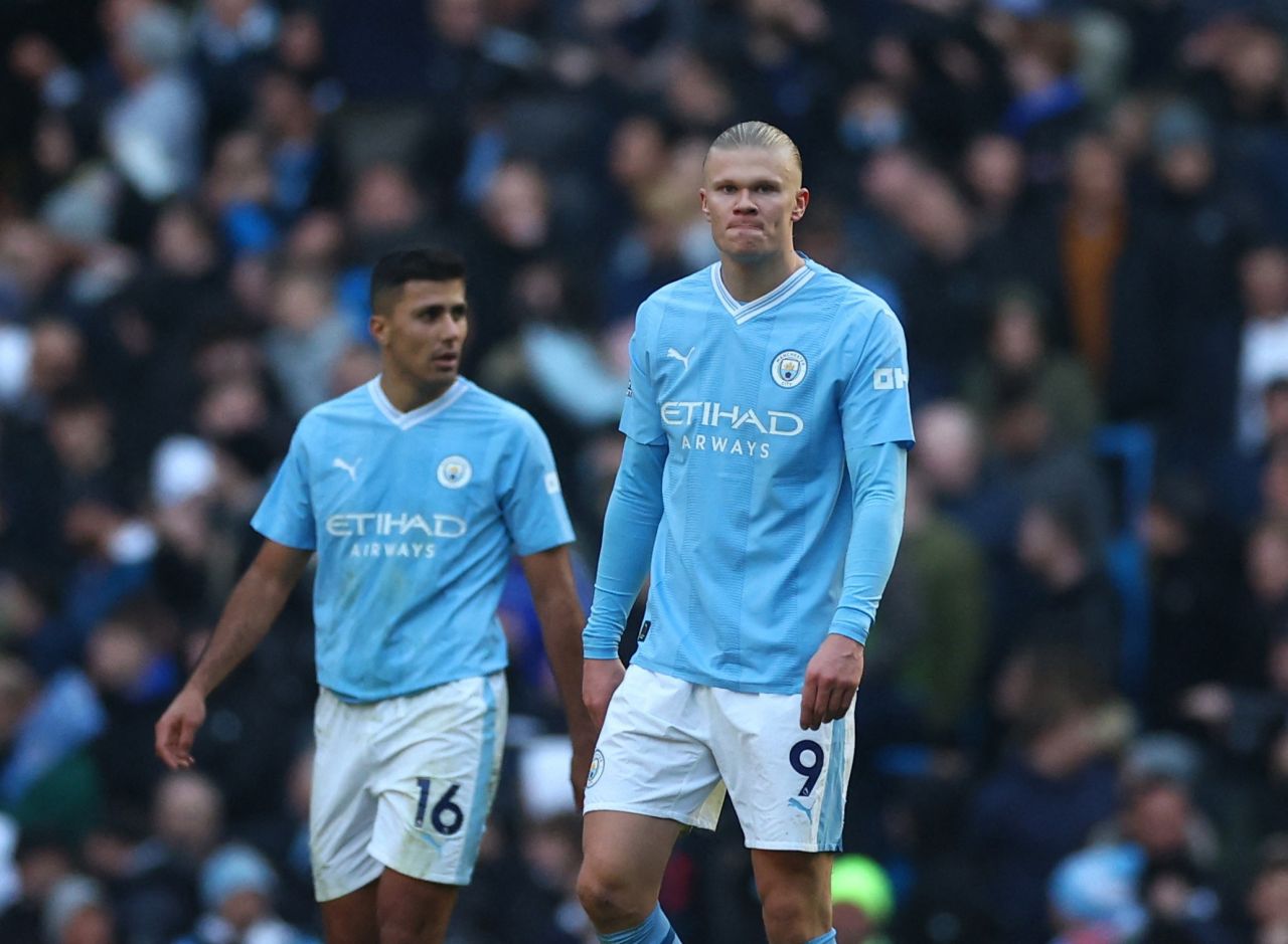 Erling Haaland e Rodri após partida do Manchester City