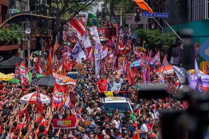Lula e Flávio Bolsonaro em eventos de campanha